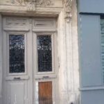 Reprise de menuiserie et vitrage neuf sur porte d'entrée d'immeuble